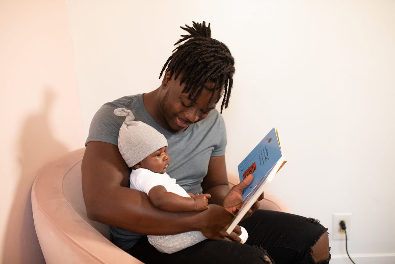 Father reading to baby