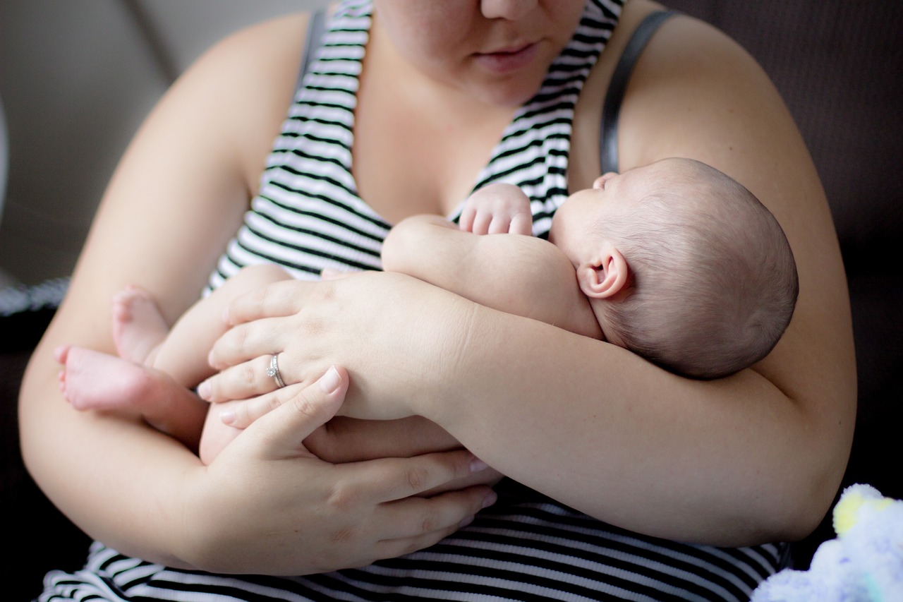 mother holding baby